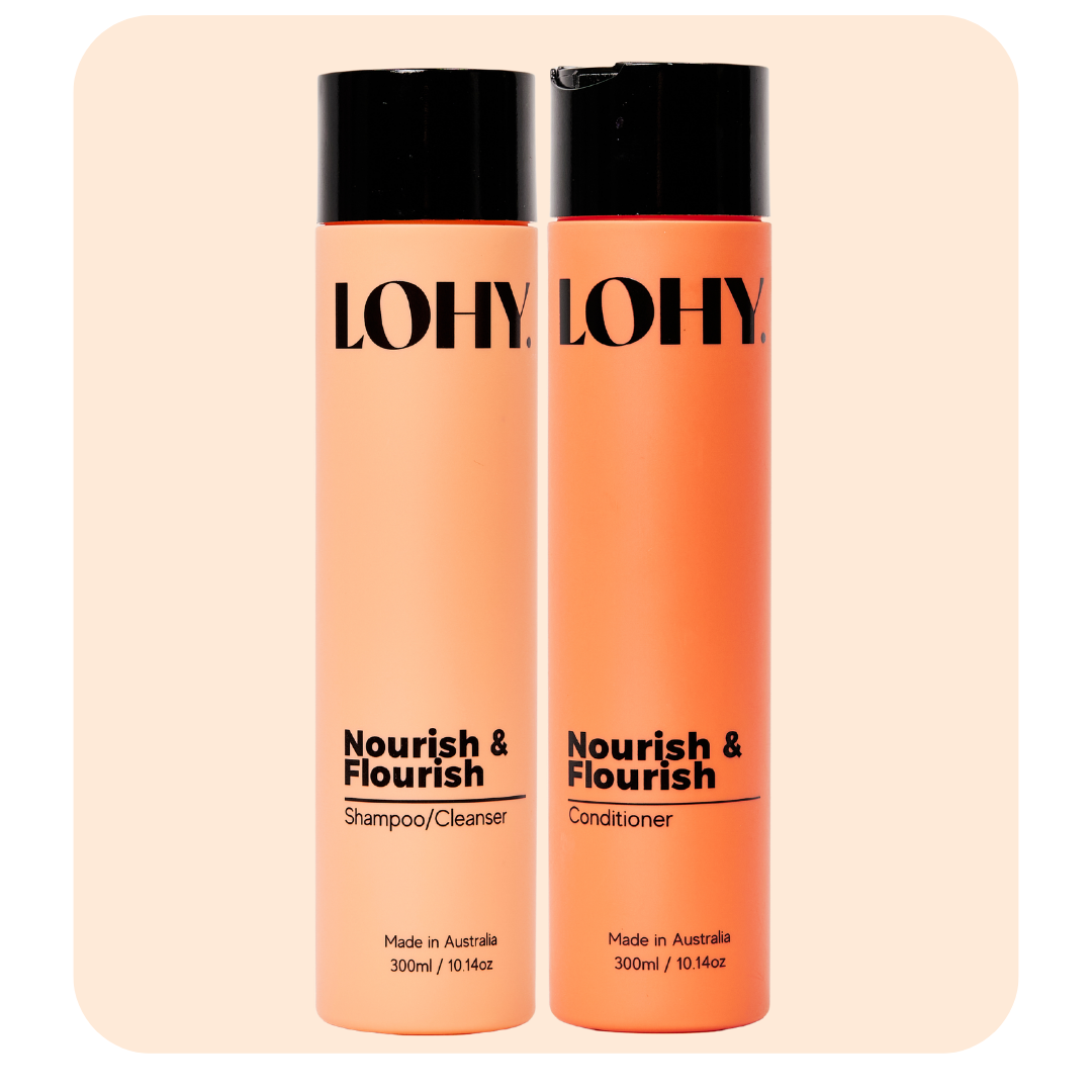 lohy nourish & flourish shampoo and conditioner 300ml bottle angled on a pastel pink background