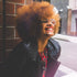 orange afro coily hair model