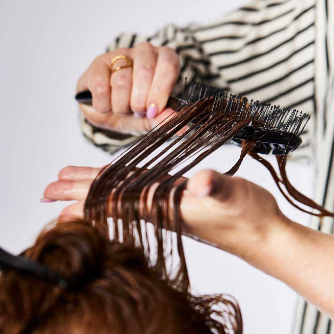 Brush through beautiful red wavy hair