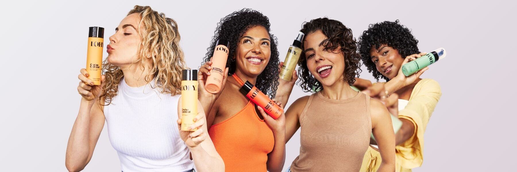 Four curly girls holding LOHY`s curly hair products
