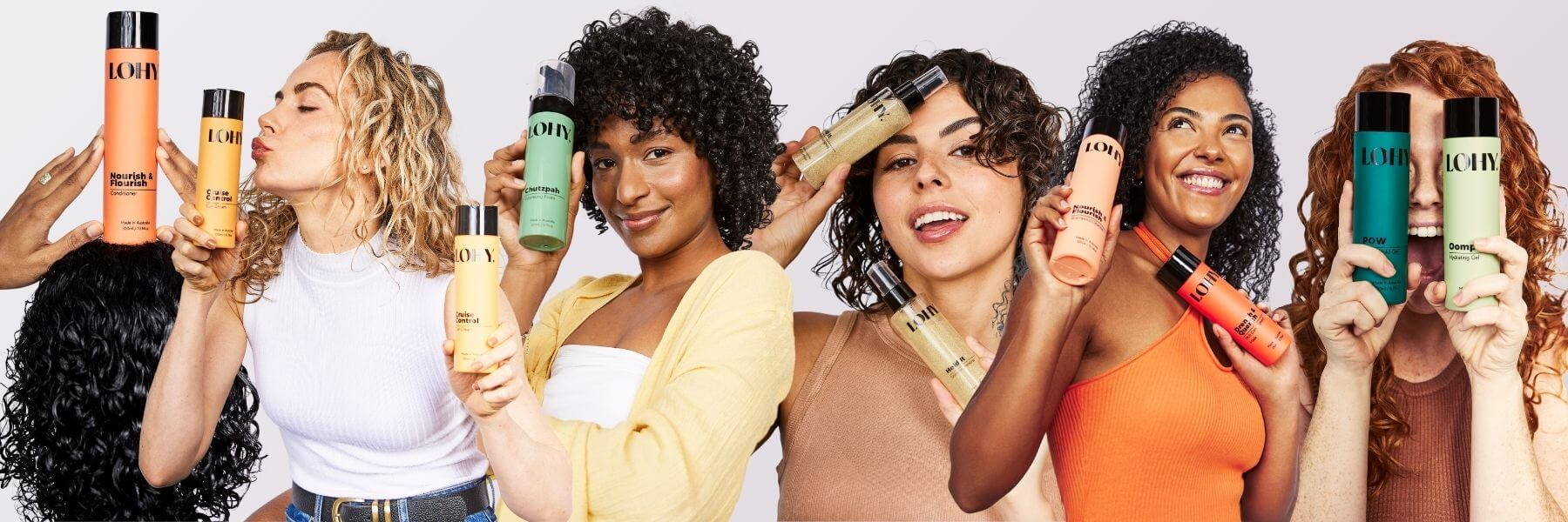 curly girls holding bottles