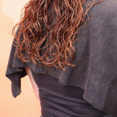 wavy 2c hair resting on a cold shoulder guard