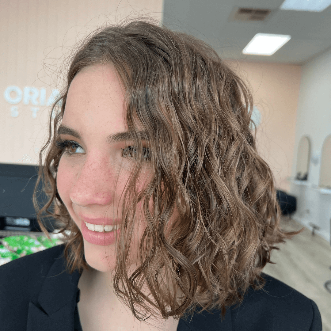 girl with short curly brunette