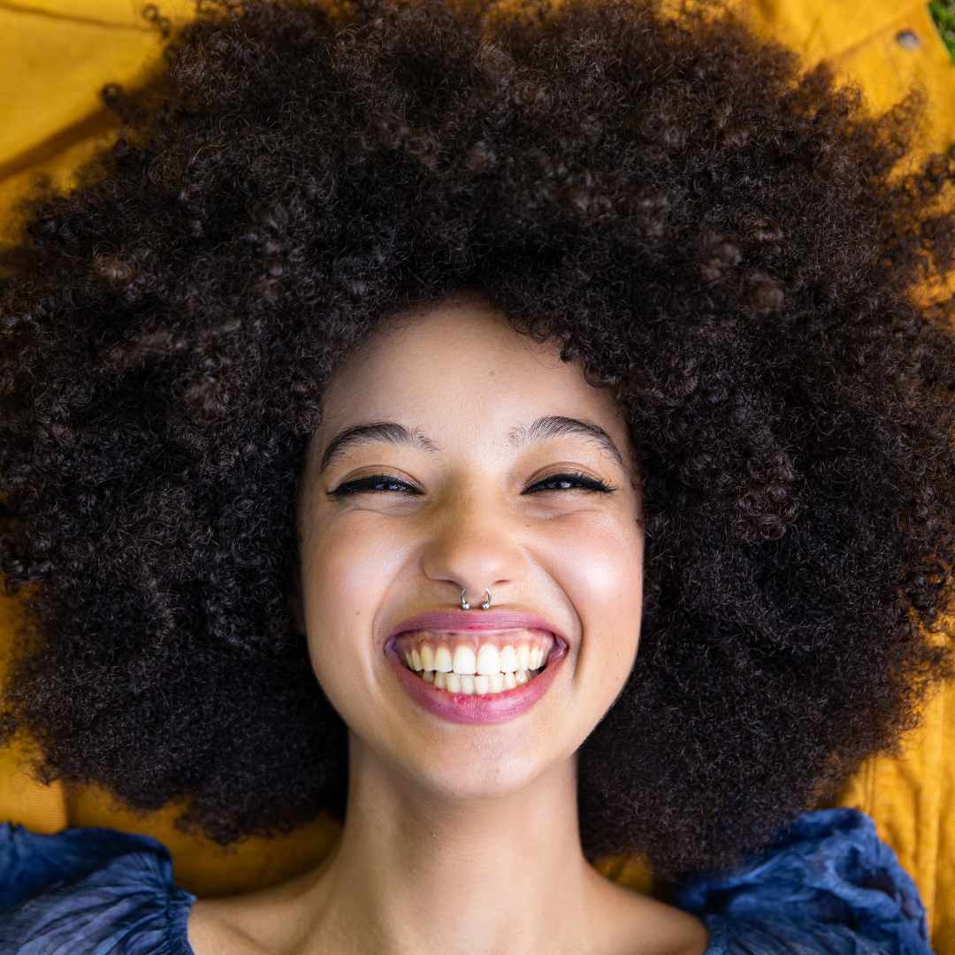 happy woman, girl, big black afro, curly black afro