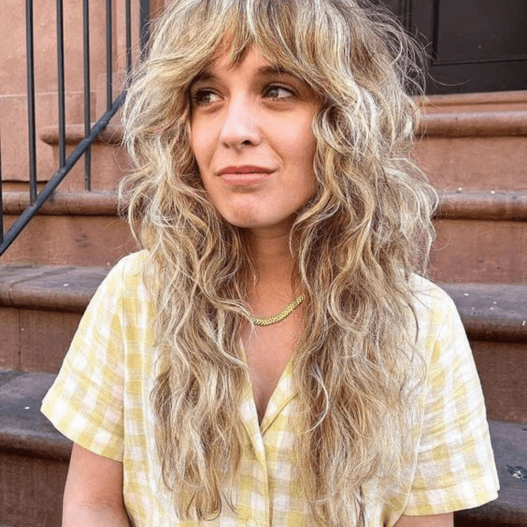 woman with long blonde curly hair