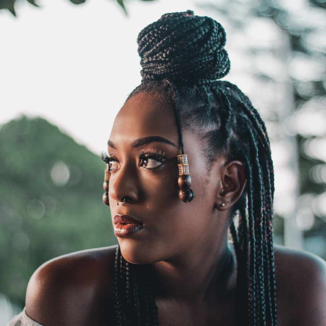 woman, half bun hairstyle, curly black hair