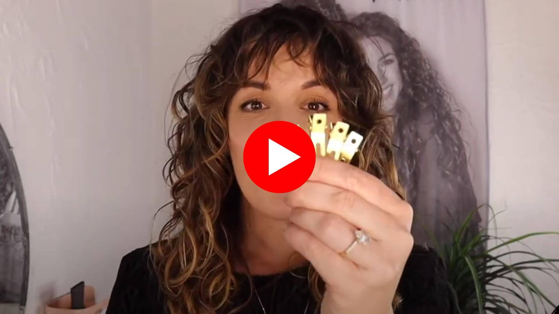 Load video: Jonina teaches how to use the gold volume clips in curly hair.