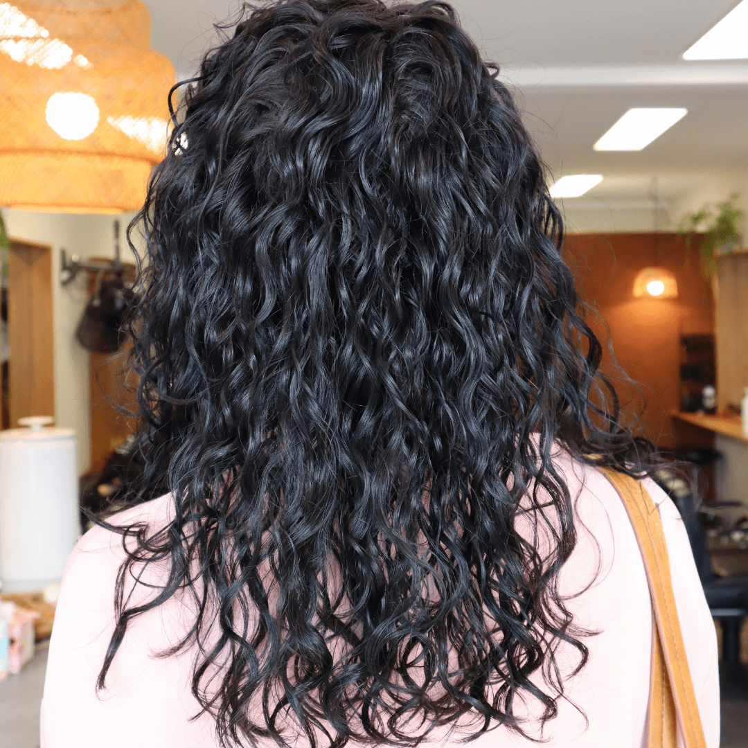 lady with long curly black hair