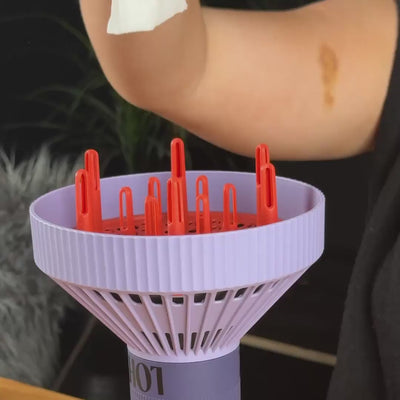 purple lohy hair diffuser attachment containing tissue with vortex air flow as tissue is dropped onto it