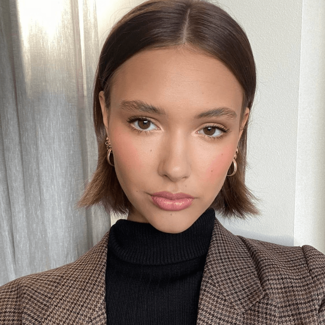 woman with short straight brunette hair