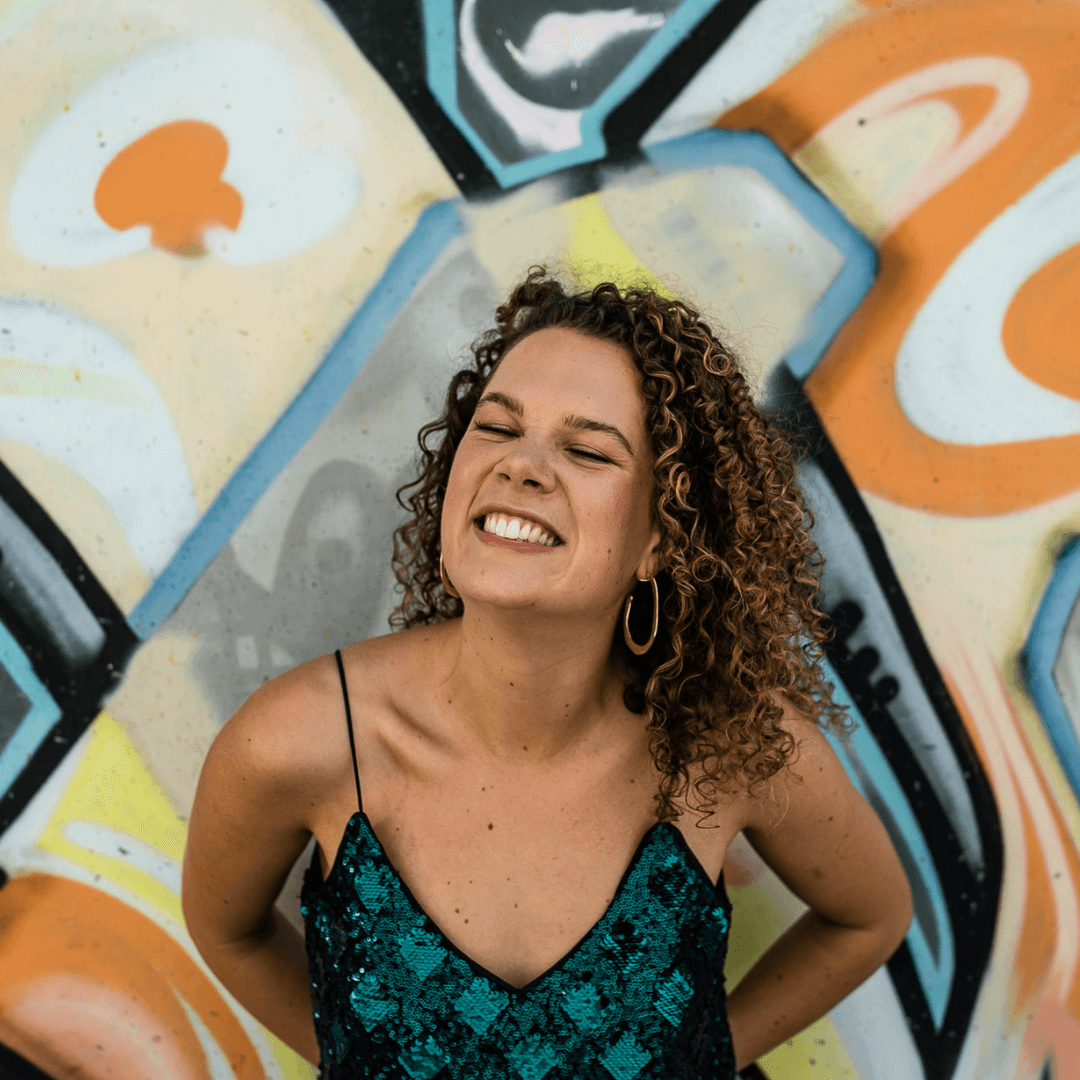 smiling girl, short brunette curly hair