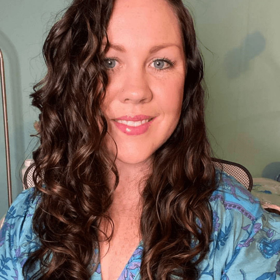 woman with long brunette curly hair