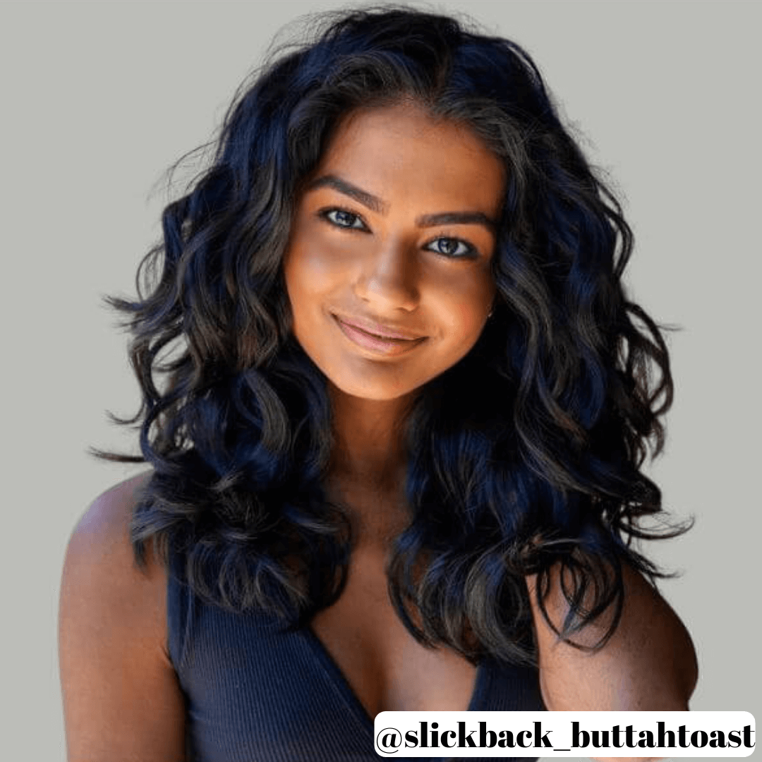 woman with shoulder length black curly hair