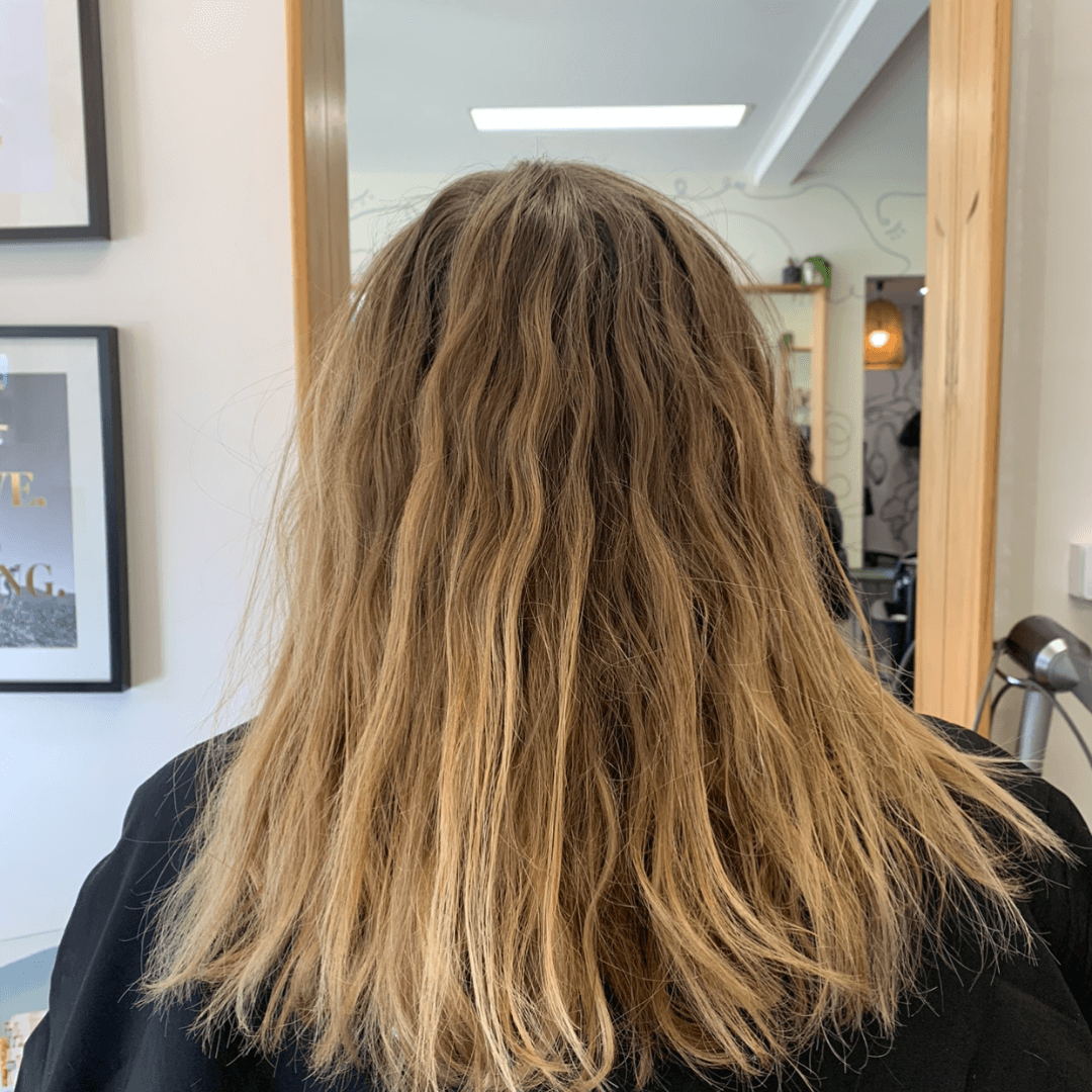 lady with shoulder length wavy blonde hair