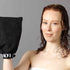 Red curly girl with wet hair holding the LOHY glove